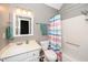 This bathroom offers a shower and tub combo, vanity, and updated fixtures at 716 S Meadow Rd, Raleigh, NC 27603