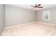 This bedroom features carpet flooring, neutral paint, and a ceiling fan with lighting at 716 S Meadow Rd, Raleigh, NC 27603