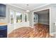 Eat-in kitchen with bay window offering natural light and an open view to the living room at 716 S Meadow Rd, Raleigh, NC 27603