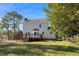 A backyard exterior view of the home and deck at 716 S Meadow Rd, Raleigh, NC 27603