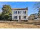 Traditional two-story home with manicured lawn and mature trees offering curb appeal at 716 S Meadow Rd, Raleigh, NC 27603