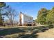 Backyard exterior of the house and a utility shed at 716 S Meadow Rd, Raleigh, NC 27603