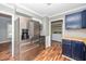 This kitchen features stainless steel appliances, contrasting countertops, and a nearby laundry area at 716 S Meadow Rd, Raleigh, NC 27603
