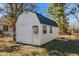 A backyard utility shed with doors and windows at 716 S Meadow Rd, Raleigh, NC 27603