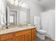 Bathroom featuring a granite vanity, large mirror, and a shower with a white curtain at 723 Renshaw Ct, Cary, NC 27518