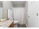 Bathroom featuring a toilet, granite vanity, and a shower/tub with white curtain at 723 Renshaw Ct, Cary, NC 27518