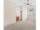 Spacious bedroom with carpet flooring, neutral paint, ceiling fan, and ensuite bathroom at 723 Renshaw Ct, Cary, NC 27518