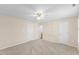 Large bedroom featuring a ceiling fan, carpet flooring, and two closets at 723 Renshaw Ct, Cary, NC 27518