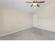 Bedroom with carpet flooring, neutral paint, ceiling fan, and white door at 723 Renshaw Ct, Cary, NC 27518
