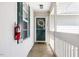 A white door with a wreath and glass in a small entryway at 723 Renshaw Ct, Cary, NC 27518