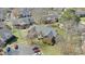 Aerial view of a two-story brick building with well-maintained landscaping and ample parking at 723 Renshaw Ct, Cary, NC 27518