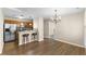 Living room view, showcases hardwood floors and kitchen bar seating at 723 Renshaw Ct, Cary, NC 27518