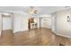 Large open-plan living room with hardwood floors and a view of the kitchen at 723 Renshaw Ct, Cary, NC 27518