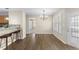 Charming living room showcasing hardwood floors and sliding glass doors to the patio at 723 Renshaw Ct, Cary, NC 27518