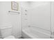 Bathroom featuring a bathtub with shower and toilet at 7317 Sandy Creek Dr, Raleigh, NC 27615