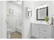 Well-lit bathroom with modern vanity, framed mirror, and combination shower and tub at 7317 Sandy Creek Dr, Raleigh, NC 27615