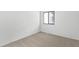 Neutral bedroom with plush carpet, natural light, and a clean, minimalist design at 7317 Sandy Creek Dr, Raleigh, NC 27615