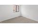 Carpeted bedroom with a window and neutral decor, providing a blank canvas for personalization at 7317 Sandy Creek Dr, Raleigh, NC 27615