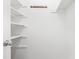Walk-in closet with open shelving and hanging rod, providing ample storage space at 7317 Sandy Creek Dr, Raleigh, NC 27615