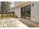 Large wood deck offers space for outdoor enjoyment with a sliding glass door to the interior at 7317 Sandy Creek Dr, Raleigh, NC 27615