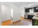 Open kitchen with stainless steel appliances, contrasting cabinets, and hardwood style flooring at 7317 Sandy Creek Dr, Raleigh, NC 27615