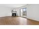 Bright living room with a fireplace and access to the deck through sliding glass doors at 7317 Sandy Creek Dr, Raleigh, NC 27615