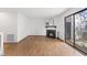 Open living room featuring a fireplace and sliding glass doors to the outdoor patio at 7317 Sandy Creek Dr, Raleigh, NC 27615
