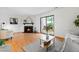Inviting living space features a fireplace, deck access, and stylish, comfortable furnishings at 7317 Sandy Creek Dr, Raleigh, NC 27615