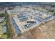 Aerial view of townhomes with solar panels, showcasing the community layout and streetscape at 7802 Flatrock Park Dr # 131, Knightdale, NC 27545