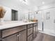 Modern bathroom with double sinks, ample counter space, and a glass-enclosed shower exudes clean sophistication at 7802 Flatrock Park Dr # 131, Knightdale, NC 27545