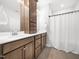 Bathroom featuring double sinks, modern vanity, and shower with a curtain, designed for convenience and style at 7802 Flatrock Park Dr # 131, Knightdale, NC 27545
