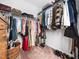 Well-organized walk-in closet with shelving and hanging rods maximizes storage for clothes, bags, and accessories at 7802 Flatrock Park Dr # 131, Knightdale, NC 27545