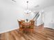 Dining room features a wood table set with chairs and wood floors at 7802 Flatrock Park Dr # 131, Knightdale, NC 27545