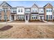 The exterior of these townhomes features a blend of brick and siding, complemented by well-maintained landscaping at 7802 Flatrock Park Dr # 131, Knightdale, NC 27545