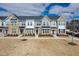 New townhomes boasting varied facade colors, complemented by well-kept lawns and fresh landscaping at 7802 Flatrock Park Dr # 131, Knightdale, NC 27545