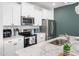Modern kitchen with stainless appliances, granite countertops, and a subway tile backsplash at 7802 Flatrock Park Dr # 131, Knightdale, NC 27545