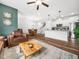 Spacious open-concept interior showcasing the living room, dining area, and kitchen with staircase at 7802 Flatrock Park Dr # 131, Knightdale, NC 27545