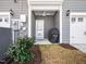 A covered patio with a ceiling fan and a grill provides a perfect outdoor space for relaxation and entertaining at 7802 Flatrock Park Dr # 131, Knightdale, NC 27545
