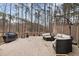 Outdoor deck area featuring patio furniture, an umbrella, a grill, and wooded views at 7904 Kingsland Dr, Raleigh, NC 27613