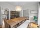 Bright dining room boasts hardwood floors, modern lighting, and stylish bench seating at 7904 Kingsland Dr, Raleigh, NC 27613
