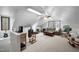 Large bonus room with a sloped ceiling, a ceiling fan, neutral carpet, and large windows at 7904 Kingsland Dr, Raleigh, NC 27613