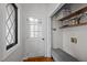 Mud room featuring natural light, a bench, and convenient storage shelves at 7904 Kingsland Dr, Raleigh, NC 27613