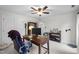 Office featuring a ceiling fan, computer setup, and a cozy seating area at 7904 Kingsland Dr, Raleigh, NC 27613