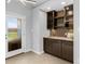 Butler's pantry with custom cabinetry, lighting, and countertop space at 809 Handel Ln, Apex, NC 27502