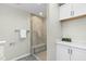 Bathroom featuring frameless shower, built in bench, and ample storage at 809 Handel Ln, Apex, NC 27502
