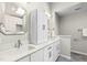 Bathroom with double vanity, storage cabinet, and unique mirror at 809 Handel Ln, Apex, NC 27502