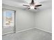 Simple bedroom with neutral carpet, ceiling fan, and natural light from window at 809 Handel Ln, Apex, NC 27502
