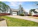 View of the house from the side showing driveway and garage at 809 Handel Ln, Apex, NC 27502