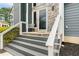 Close up of the entryway with seating and stone accents at 809 Handel Ln, Apex, NC 27502