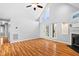 Bright living room featuring vaulted ceilings, fireplace, and wood floors at 809 Handel Ln, Apex, NC 27502